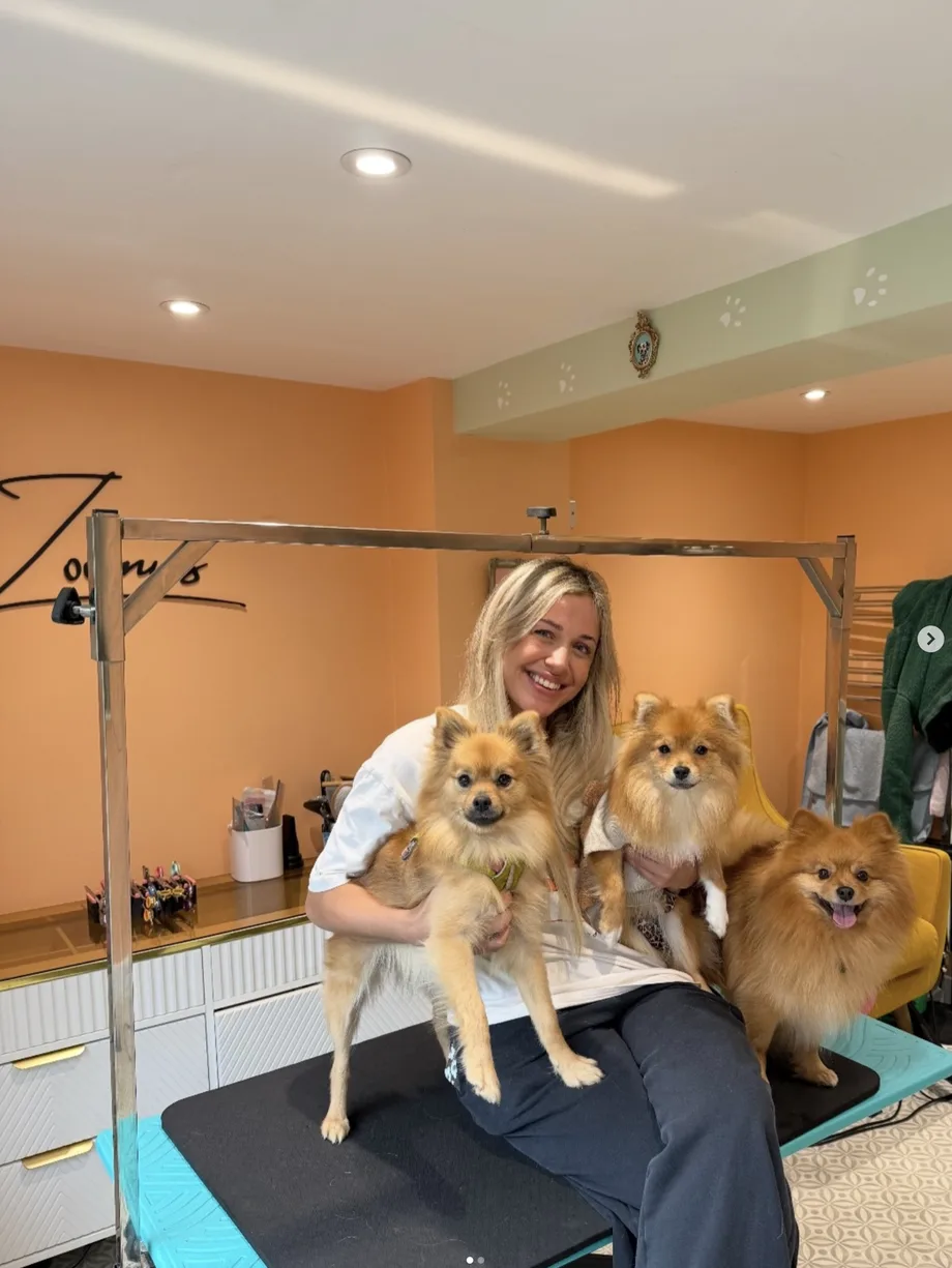 Emma with dogs at Zoomies Dog Grooming salon